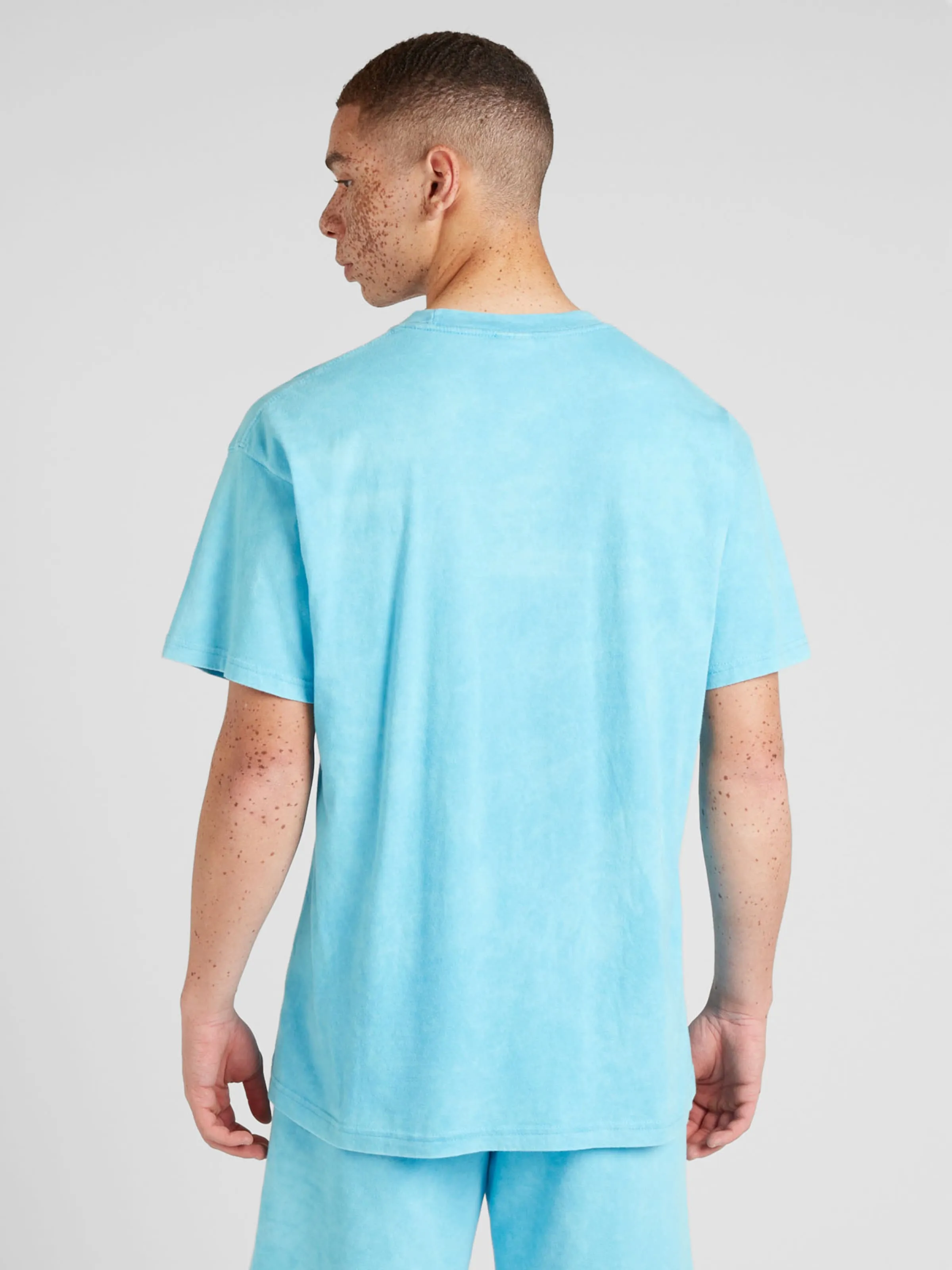 Camiseta 'CLUB' Nike Sportswear en Azul Claro