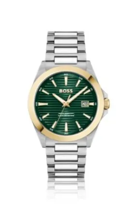 Reloj de tono dorado y plateado con esfera verde ranurada